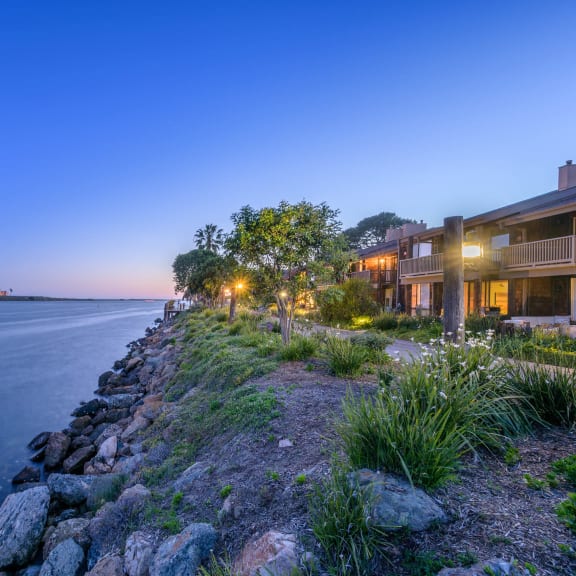 a home on the water overlooking the water at night at Mariners Village, Marina del Rey, California