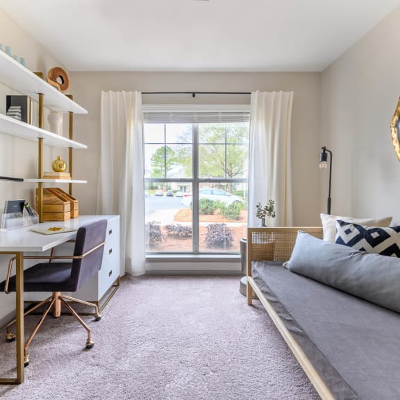 a bedroom with a bed and a desk and a window at Ashford Green, Charlotte, 28262