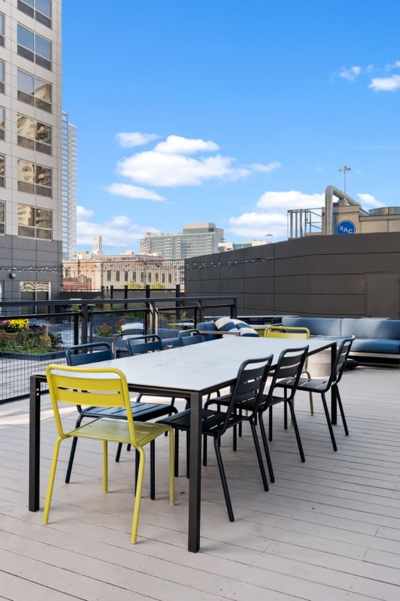 Rooftop lounge with grills, seating, and games at Presidential Towers in Chicago, IL at Presidential Towers, Chicago, IL, 60661
