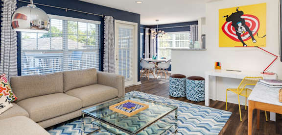 a living room with a couch and a glass coffee table at Residences at Stevens Pond, Saugus, Massachusetts 01906