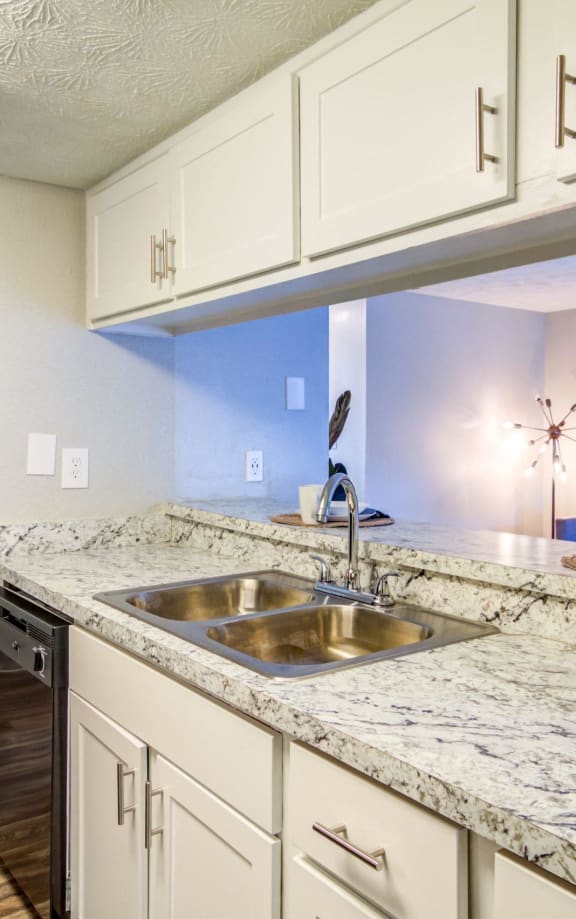 an open kitchen with white cabinets and granite counter tops at Glen Hollow, Decatur, GA, 30034