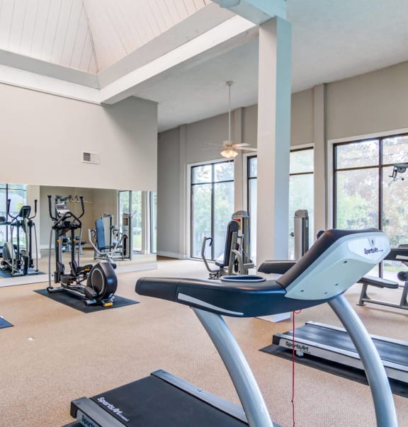 the gym with treadmills and other exercise equipment at the enclave at woodbury at Glen Hollow, Georgia
