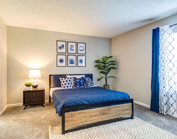 a bedroom with a bed and a ceiling fan at Glen Hollow, Georgia