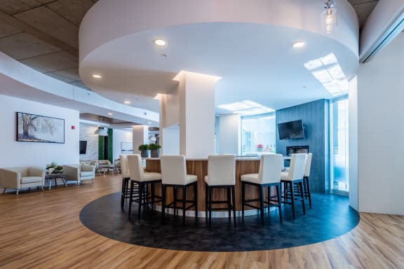 a large dining room with a table and chairs and a fireplace
