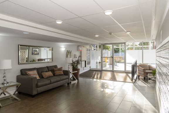a living room and dining room with a couch and a table
