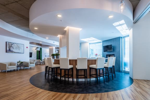 a large dining room with a table and chairs and a fireplace