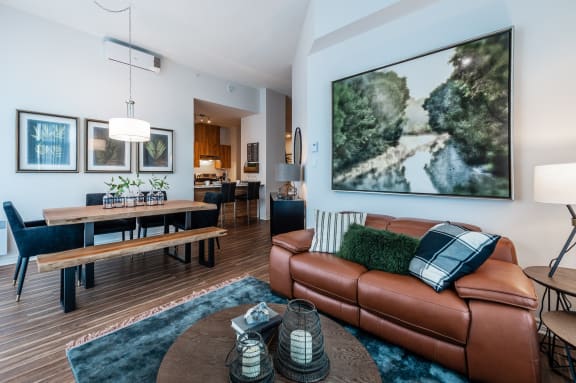 a living room and dining room with a couch and a table