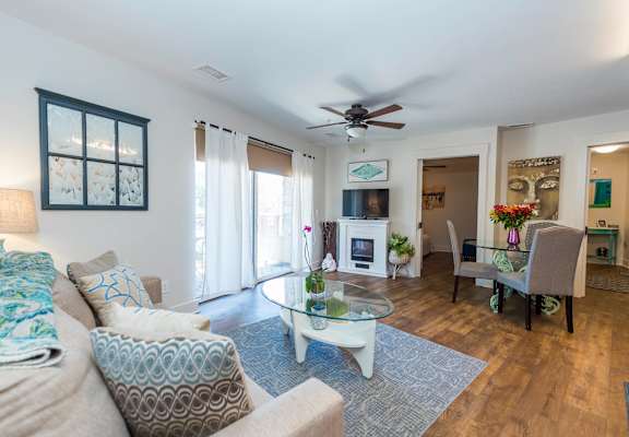 a living room with furniture and a ceiling fan at Roaring Fork Apartments, Basalt, Colorado