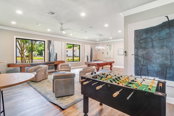 a living room with a couch and a ceiling fan  at The Vineyard of Olive Branch Apartment Homes, Olive Branch, 38654