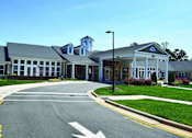 Thumbnail 5 of 5 - the front of a building with a road in front of it