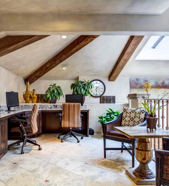 a home office with a desk and a table with chairs at L'Estancia, Studio City, 91604
