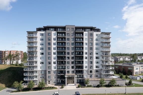 an aerial view of an apartment building on a sunny day