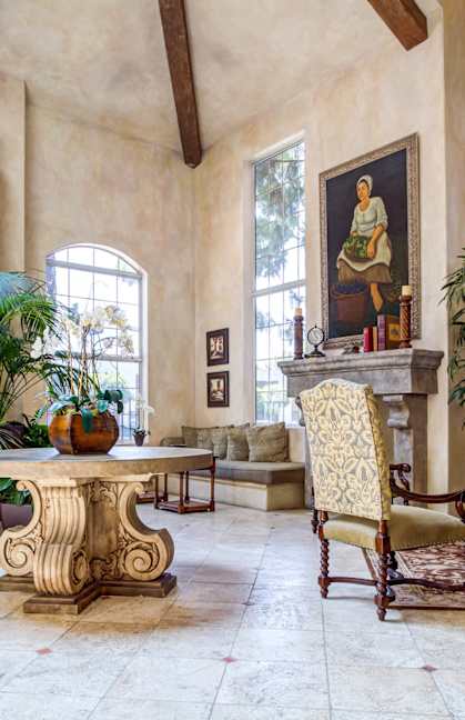 a living room filled with furniture and a table