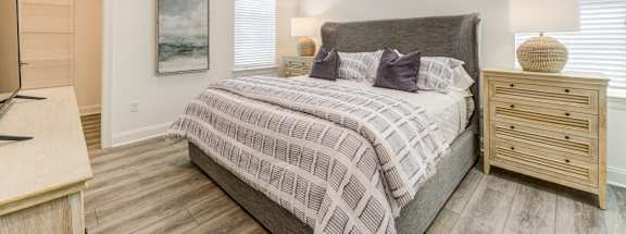 a bedroom with a bed and a ceiling fan at Residences at 393 North Apartments, Florida