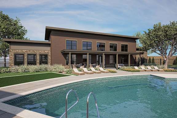 A modern house with a pool in the backyard. at The Maverick Luxury Apartments, Monument, Colorado