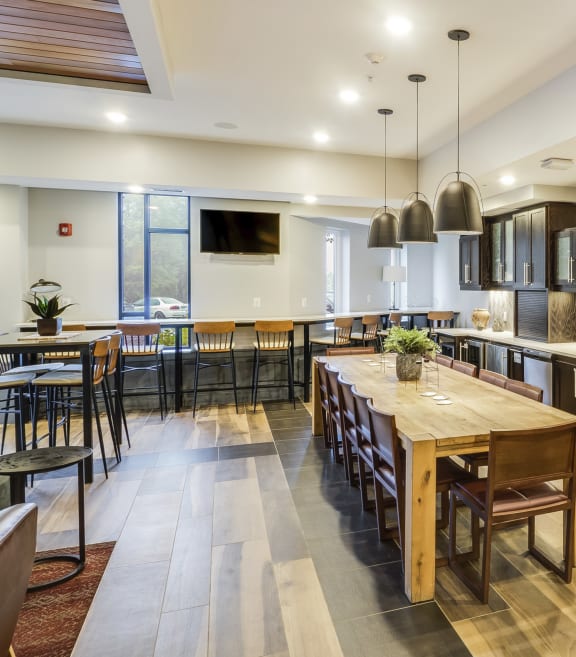 a large kitchen and dining room with a wooden table and chairs at Bluestone Flats, Minnesota, 55803