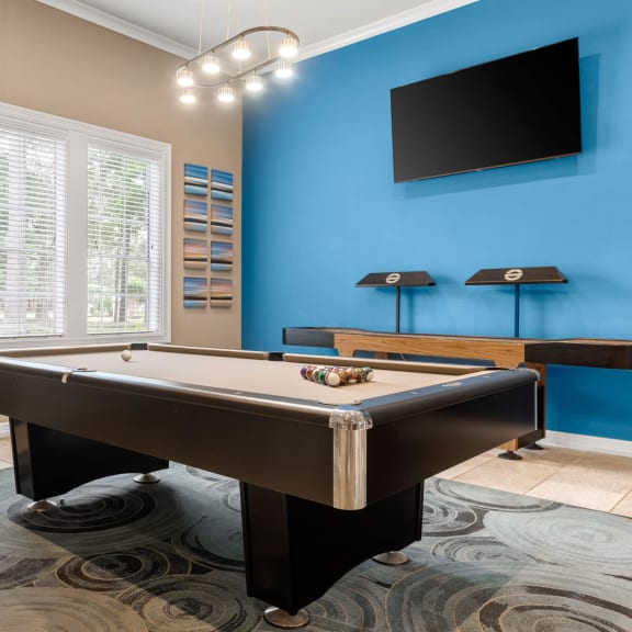 a game room with a pool table and a tv at Villages of Cypress Creek, Houston, Texas