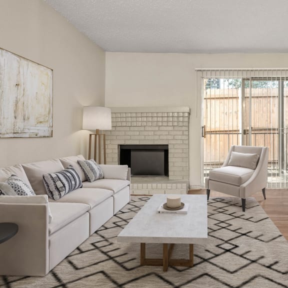 an open living room with a white couch and a television at South Lamar Village, Austin, TX, 78704