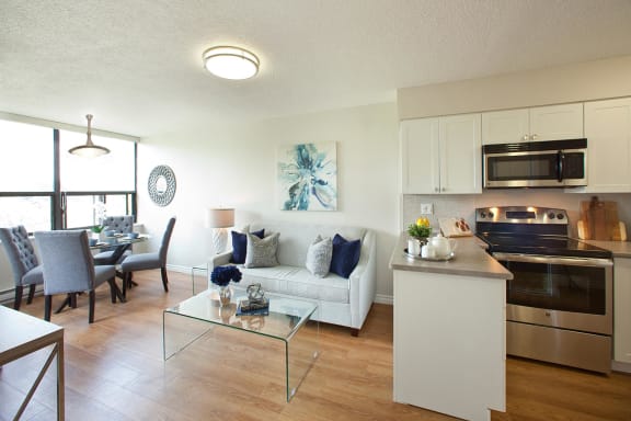 a living room with a kitchen and a dining room
