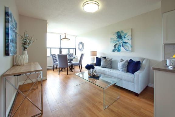 a living room and dining room with a couch and a table