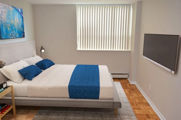 a hotel room with a bed and a television