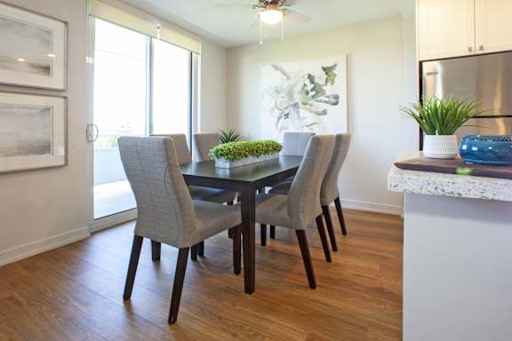 a dining room with a table and chairs