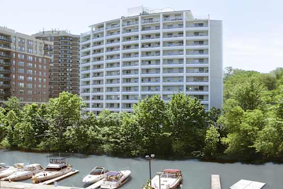 a view of a river with boats in front of a building