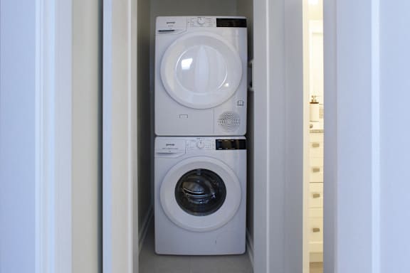 a washing machine and dryer in a small closet