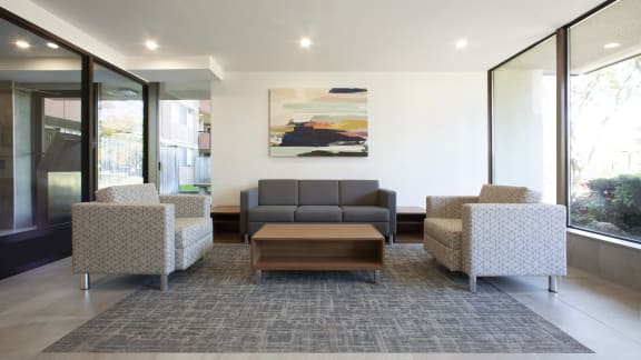 a living room with couches and chairs and a coffee table