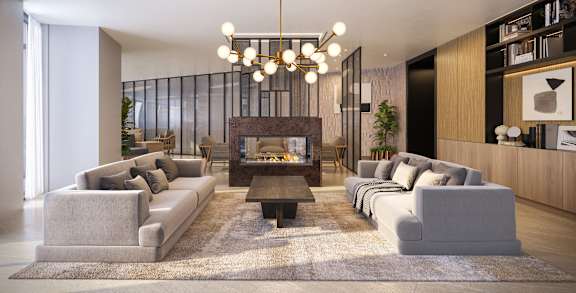 A modern living room with a fireplace and grey couches.