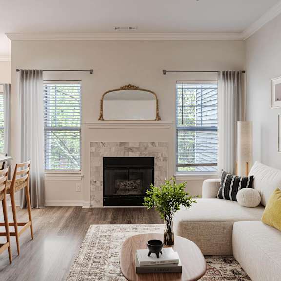 a living room and kitchen with a couch and a table
