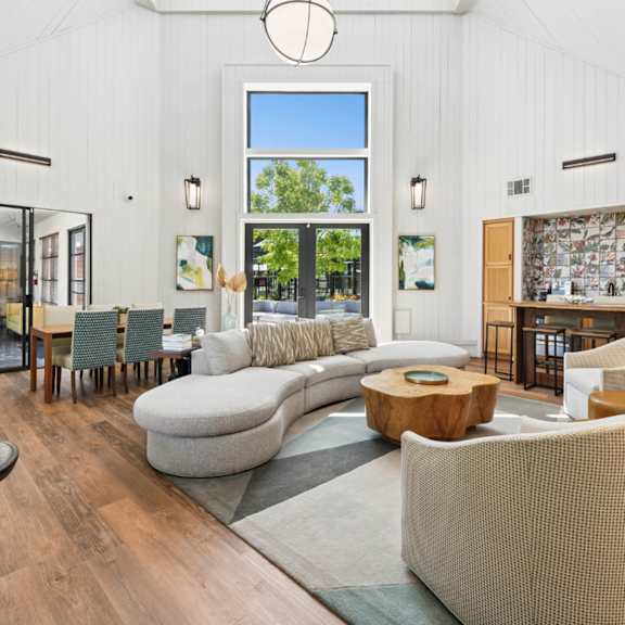 A living room with grey couches and a coffee table.