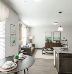 an open kitchen and living room with a dining room table at Village at Westland Cove Apartments, Tennessee, 37922