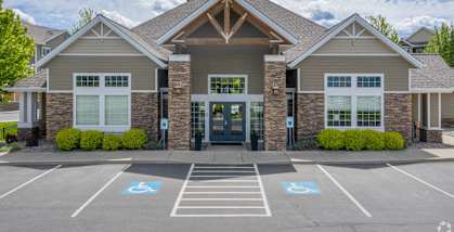 A building with a parking lot in front of it.