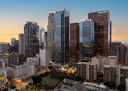 A cityscape with tall buildings and a clear sky.