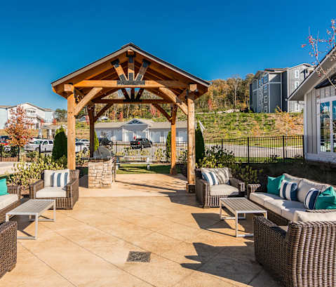 the outdoor patio of a home with chairs and a gazebo at Village at Westland Cove Apartments, Tennessee