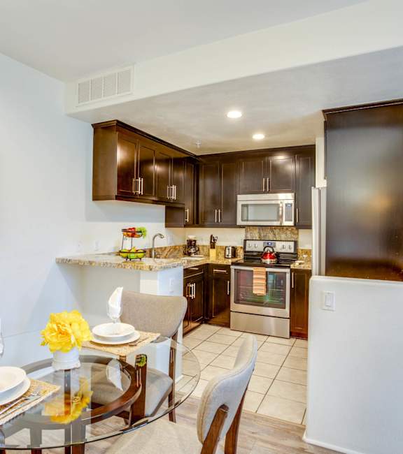 a reflection of a dining room with a kitchen in a window at L'Estancia, Studio City, CA, 91604