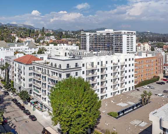 an aerial view of a city with tall buildings and trees The Baxter in Los Angeles, CA 90028