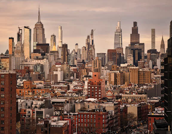 A cityscape with a mix of modern and older buildings.