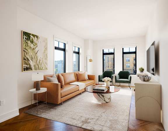 a living room with a brown couch and a rug