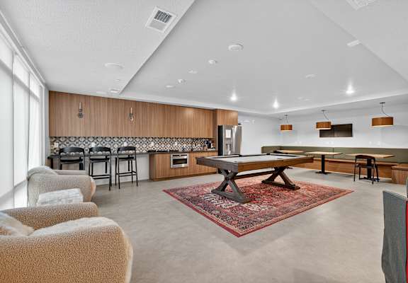 A modern living room with a fireplace and a dining table.