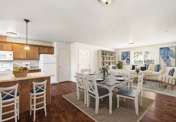 a kitchen and dining room with a table and chairs at Pine Tree Park, Kennewick