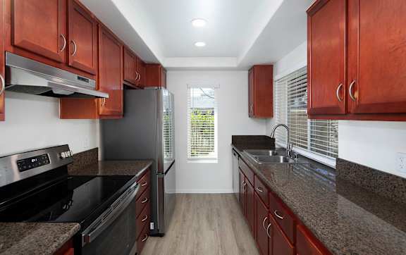 Kitchen with cabinets at Bella Del Mar Apartments, Del Mar, California