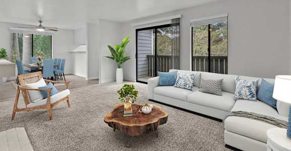 A living room with a white couch, a wooden chair, and a coffee table.