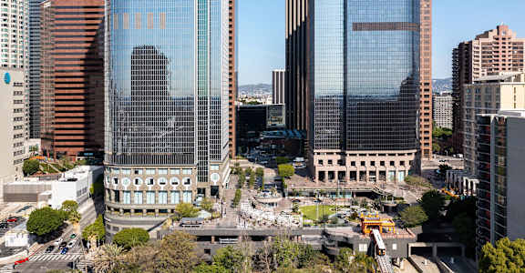 A cityscape with a large building in the center.