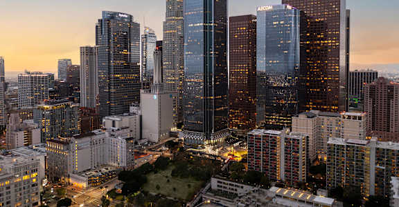 A cityscape with tall buildings and a clear sky.