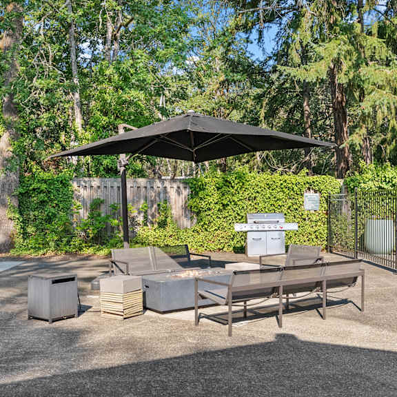 Outdoor Patio with Grill, Table and Chairs at Timbre Apartments, Lakewood, WA