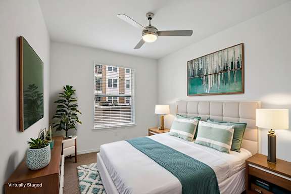 Bedroom with cozy bed at Harrisburg Lofts, Texas