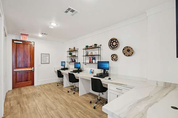 Room with desk and chair at Harrisburg Lofts, Texas, 77003