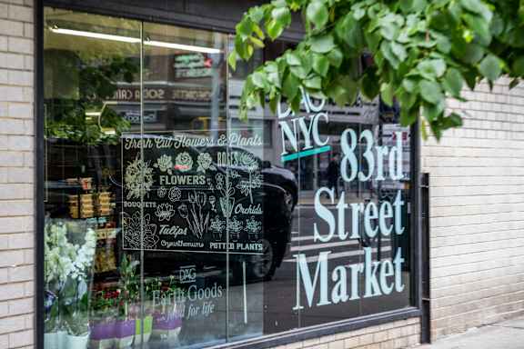 A flower shop is located at 83rd street market.